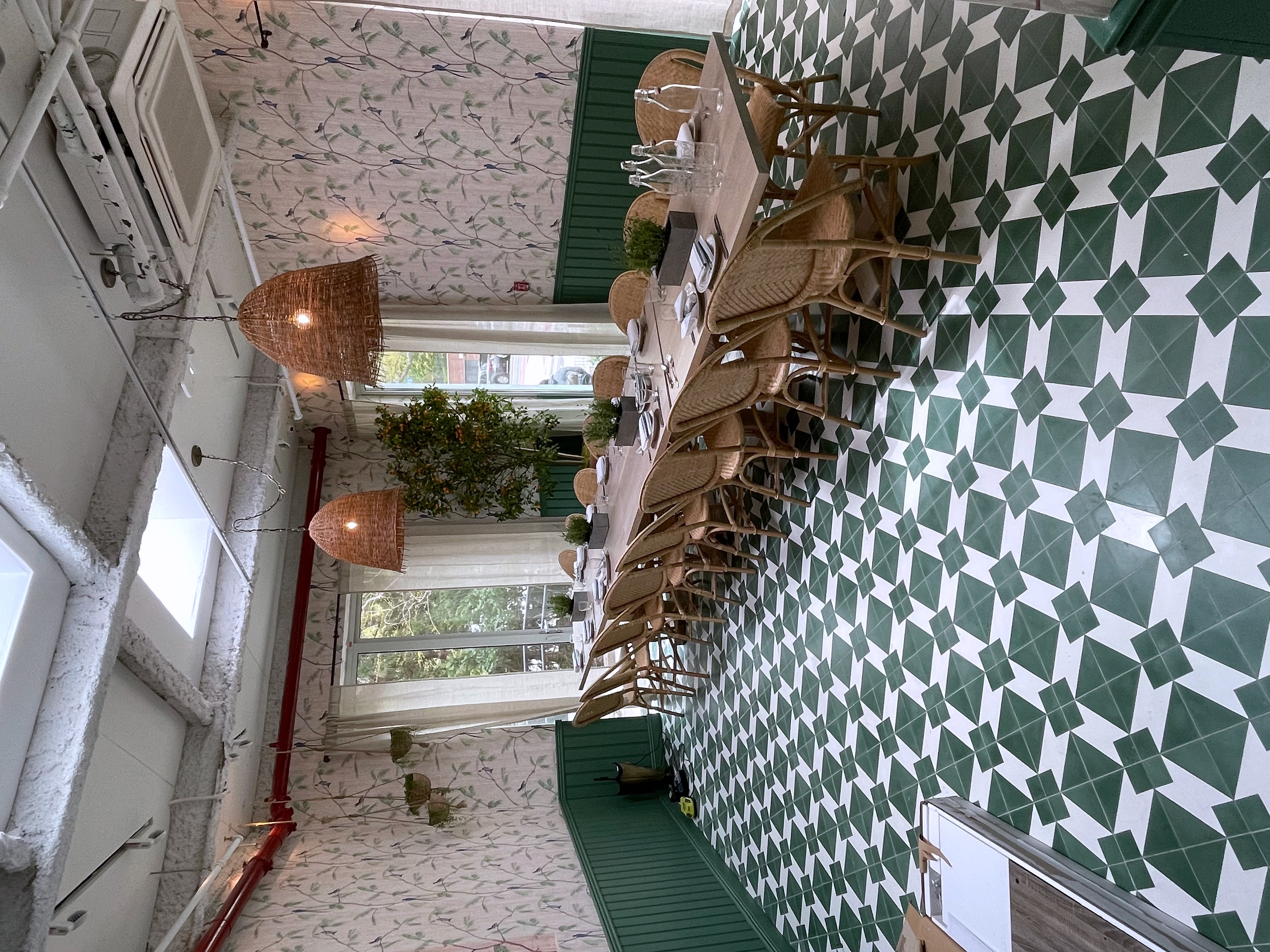 Restaurant private dining room with green tile floor, long table